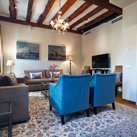 Feel right at home with the rustic ceiling beams in the living room
