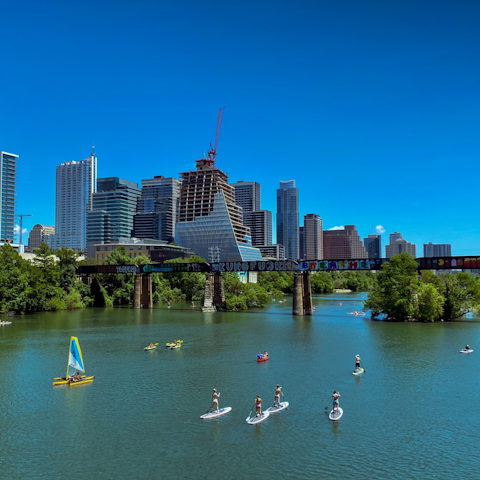 Enjoy kayaking and canoeing on Lady Bird Lake, an eight-minute drive from your door