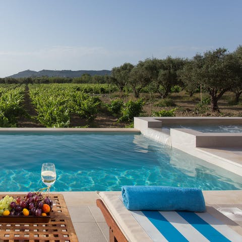 Take a dip in the crystal clear pool and hydro-massage