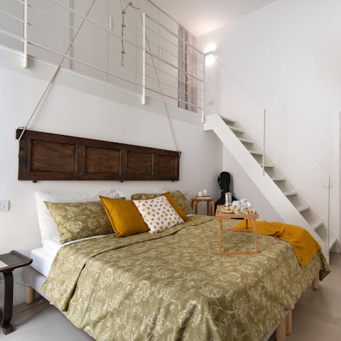 Head up to the mezzanine of the main bedroom to make use of the ample storage