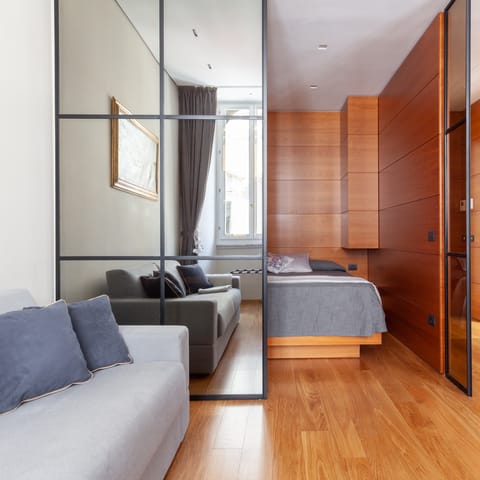 Slide open the mirrored doors to reveal the wood-framed sleeping nook