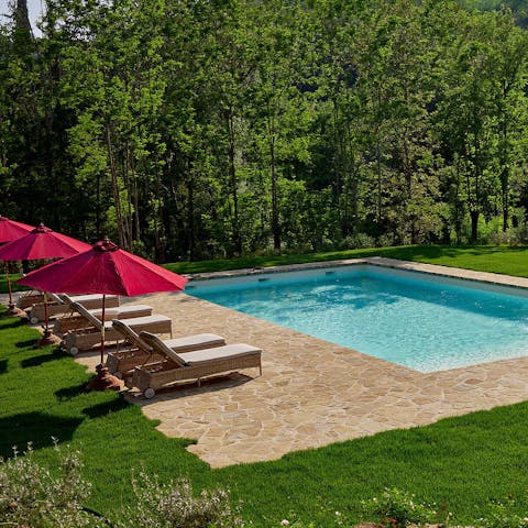 Enjoy a Prosecco by the private swimming pool