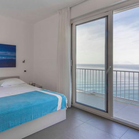 Enjoy beautiful views across the sea whilst relaxing in the bedroom