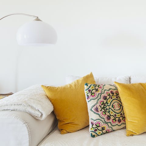 Snuggle up on the large L-shaped sofa for a movie night