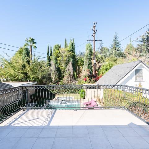 Enjoy your morning meditation on the large balcony overlooking the pool