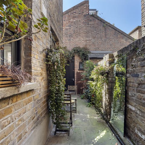 Relax with a quiet cup of tea in the rustic little garden