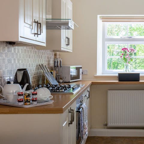 Fire up the coffee machine and rustle up brunch in the well-equipped kitchen