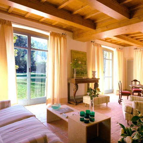 Step straight from the sunny living room to the lawn through French doors