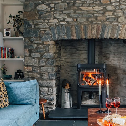 Place some logs in the wood burner and relax next to the crackling flames
