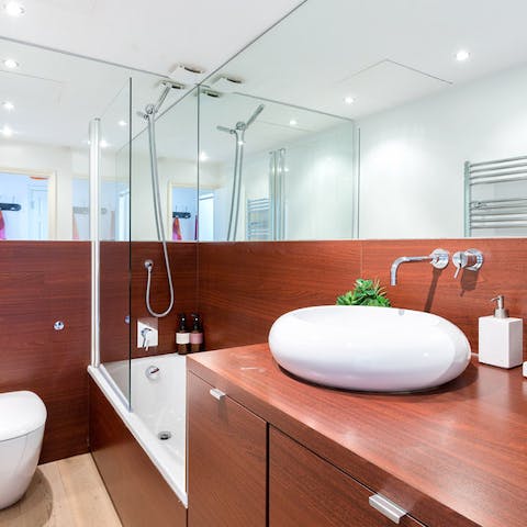 Run a bubbly bath in the stylish bathroom