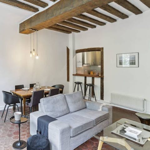 Relax in the characterful living room with a glass of Champagne