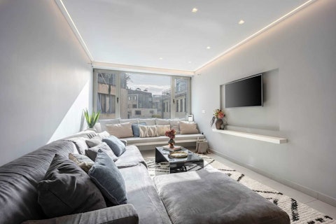 Stretch out on deep sofas and enjoy a glimpse of the Acropolis