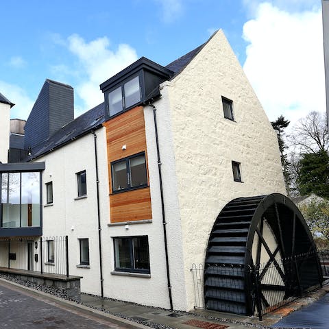 Admire the original waterwheel on the side of this former historic inn
