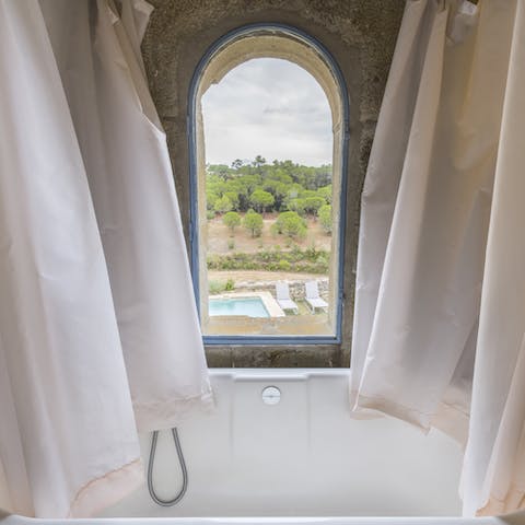 Treat yourself to a relaxing soak in the bathtub complete with a pleasing view