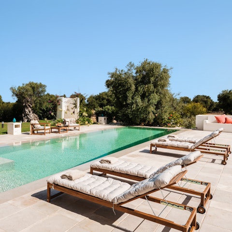Pick a spot by the pool to soak up the Italian sunshine