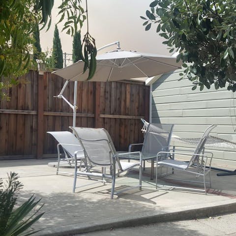 Relax and unwind in the comfy seating area in the private garden