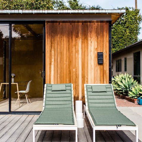 Sunbathe on the cabana's decking