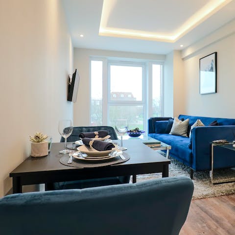 Get cosy in the bright living room, perfect for movie nights and romantic suppers
