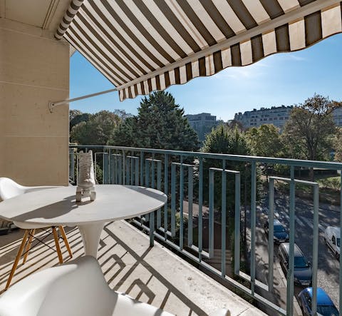 Sit out on the balcony and gaze down on Avenue Foch below
