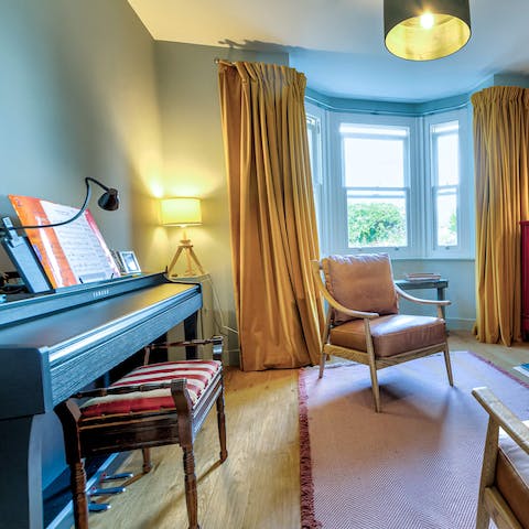 Tinkle the ivories of the home's piano