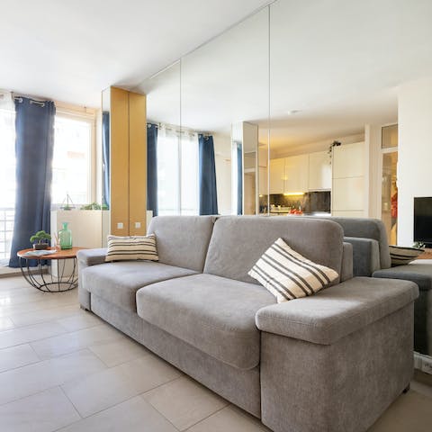 Unwind with a glass of red on the comfortable sofa