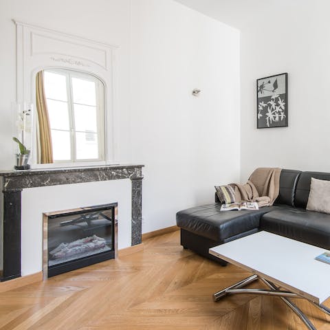 Snuggle up on the sofa around the electronic fireplace
