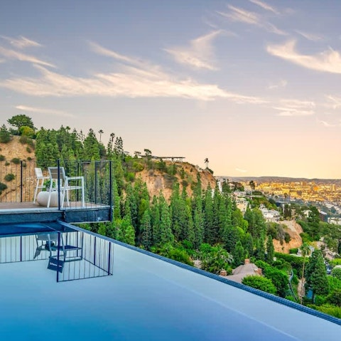 Take a dip in the infinity pool with a spectacular city view