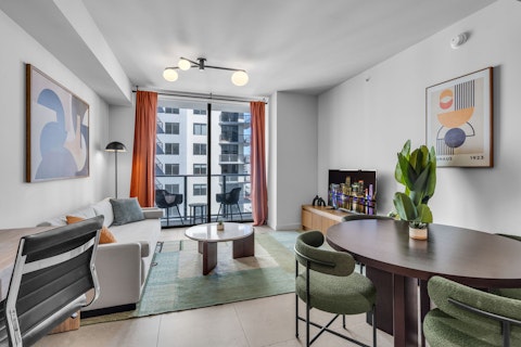Relax in a bright open living area with direct balcony access