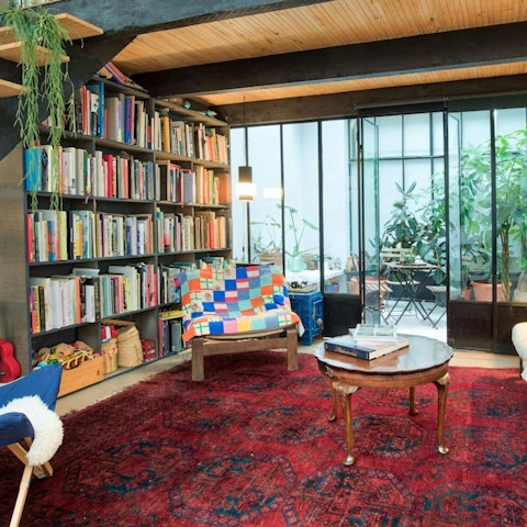 Relax with a book and a glass of French wine in the library area