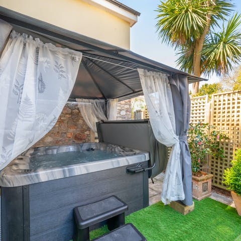 Sink into the outdoor hot tub for an indulgent soak session