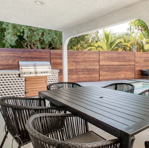 Enjoy barbecue dinner alfresco around the dining table, the perfect spot for drinks and cards