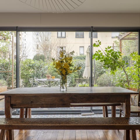 Enjoy some Parisian cuisine at the dining table overlooking the garden