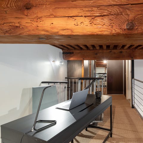 Catch up on work at the mezzanine desk area