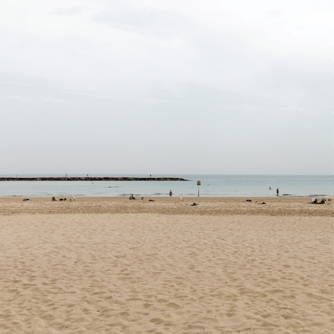 Feel the sand beneath your feet at nearby Frishman beach, just eight minutes on foot from your apartment