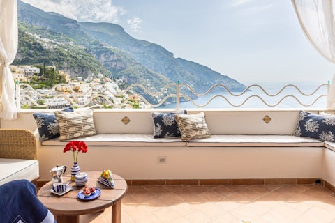Sip your morning espresso while gazing at Positano's clifftops and harbour