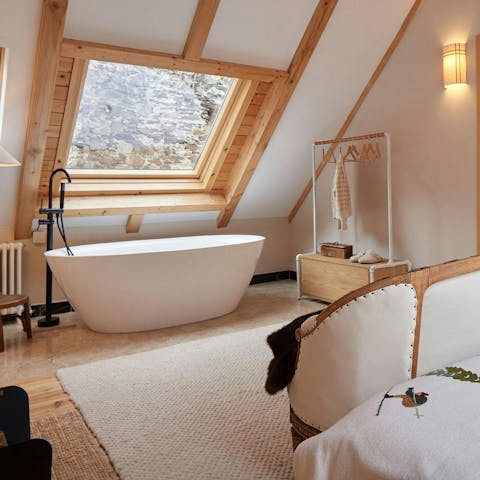 Have a long soak in the freestanding bath after a hike around Aran Park