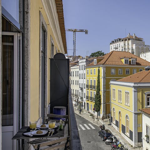 Enjoy breakfast on your traditional narrow balcony, with views out over the quiet street