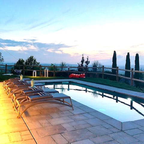 Take a refreshing dip in the crystal-clear private pool at sunset