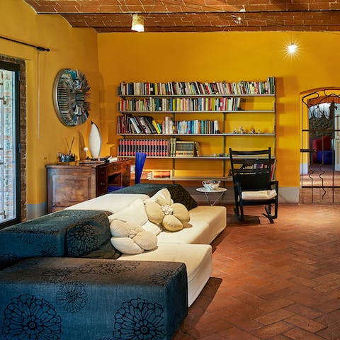 Grab a book from the shelf and sprawl out on the sofa to read
