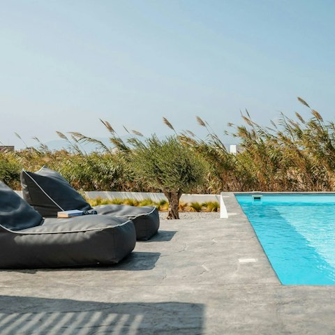 Soak up the sun on the cosy loungers beside the pool
