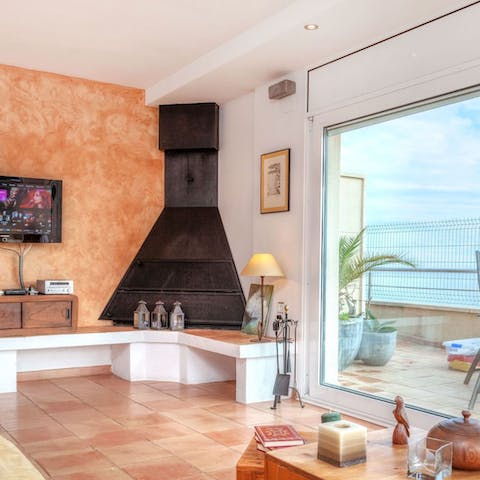 Curl up by the feature fireplace in the living room
