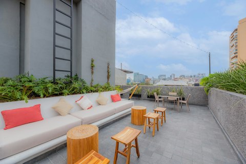 Unwind above the city skyline on the shared rooftop terrace