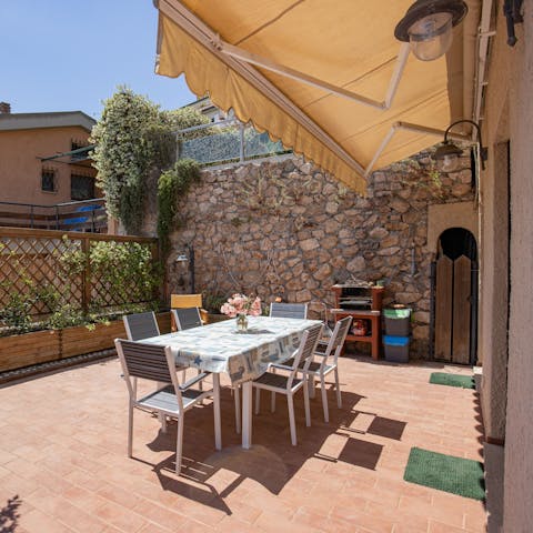 Enjoy a glass of Tuscan wine in the courtyard