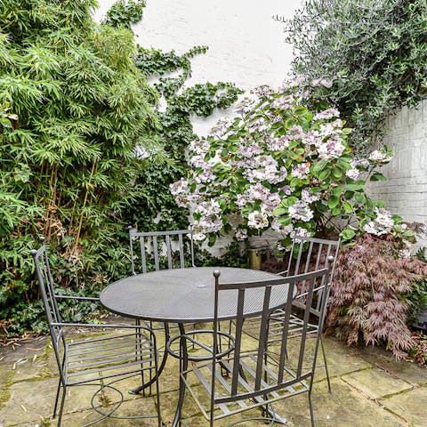 Savour morning coffees in the pretty walled garden