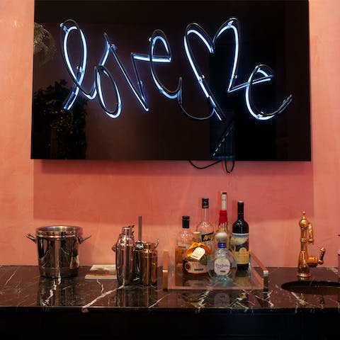 Fix up a couple of drinks at the glamorous cocktail bar