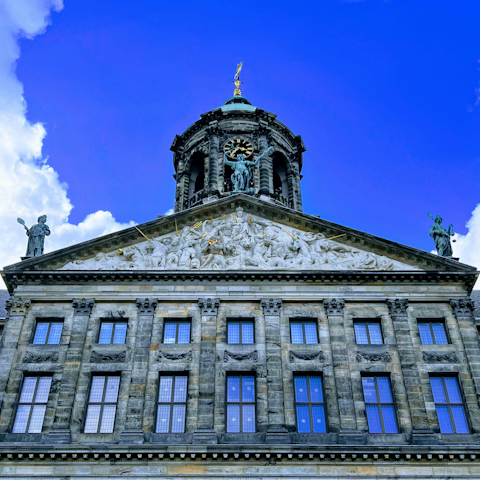 Visit the Royal Palace Amsterdam, it's seven minutes on foot