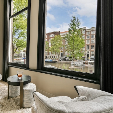 Gaze out to Amsterdam's iconic canals as you sip your morning coffee