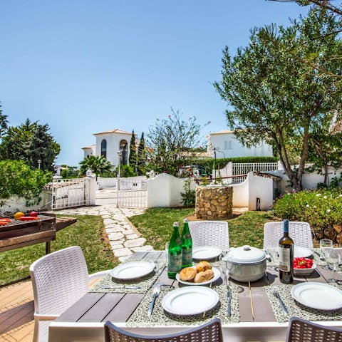 Gather for delicious alfresco meals and wine under the Algarve sky