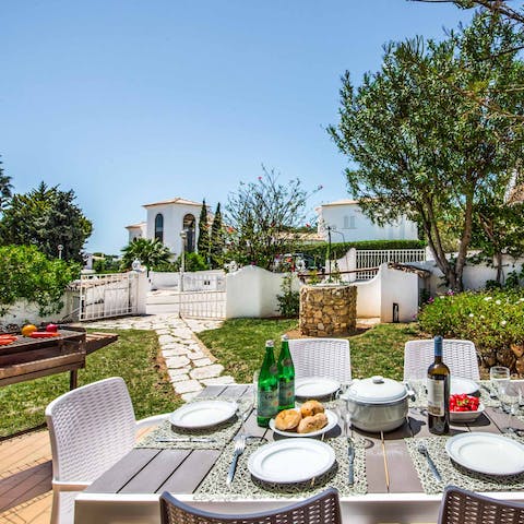 Gather for delicious alfresco meals and wine under the Algarve sky