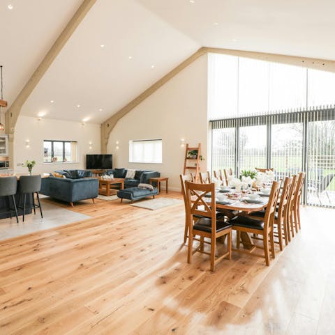 Relax in the large open-plan living area with a glass of cider
